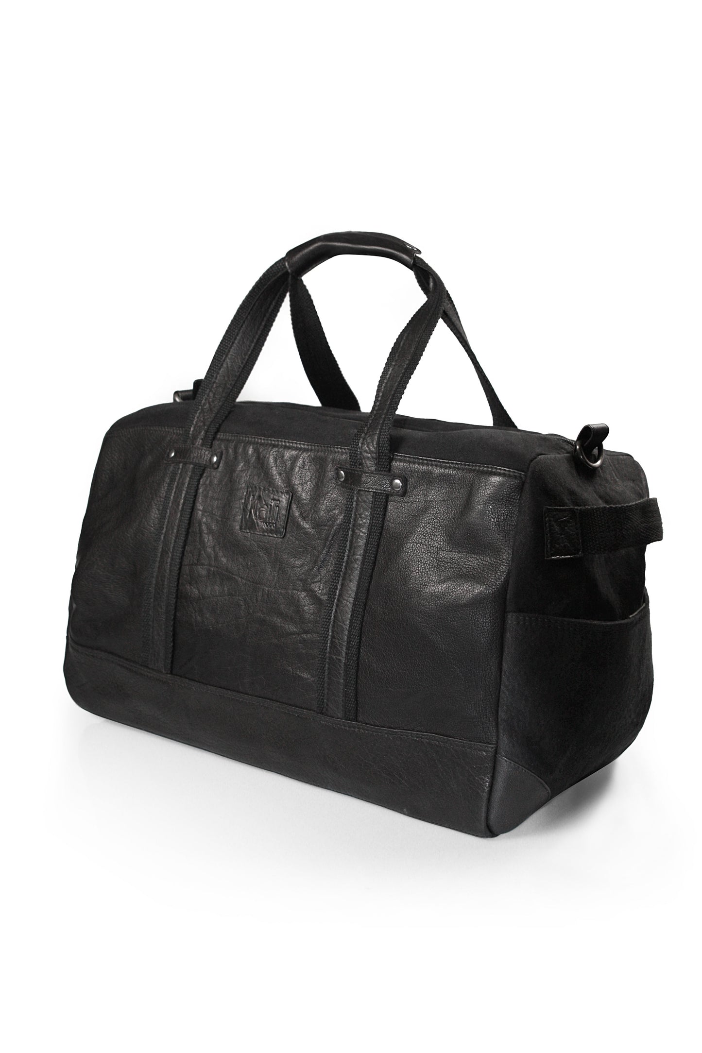 K0024AB | Canvas/Genuine Leather Travel Duffel Bag, Full Grain, Milled - Black. Antique Nickel Hardware, Zip Closure. Dimensions: 48 x 31 x 22 cm - Packaging: Non-woven Bag