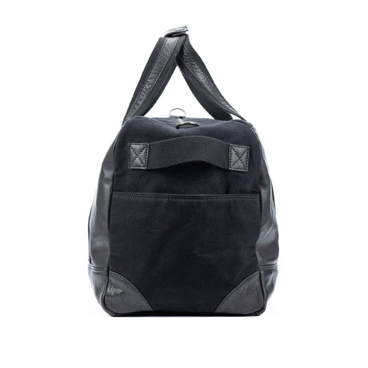K0024AB | Canvas/Genuine Leather Travel Duffel Bag, Full Grain, Milled - Black. Antique Nickel Hardware, Zip Closure. Dimensions: 48 x 31 x 22 cm - Packaging: Non-woven Bag